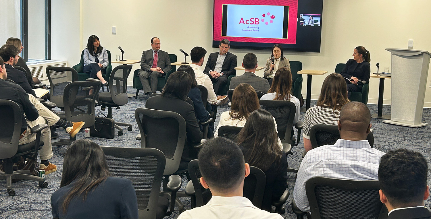 Room of people attending an in-person panel