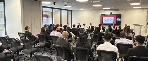Room of people attending an in-person panel
